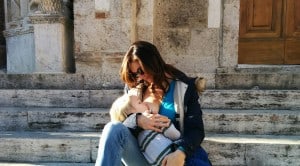 beautiful italian mother nursing toddler on stone steps