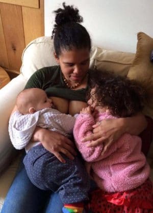 mother tandem nursing baby and toddler