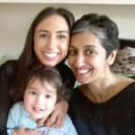 Smiling mother with her two daughters