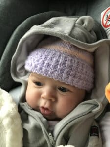 baby in car seat in winter clothes