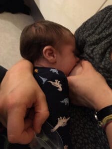 Baby feeding at the breast
